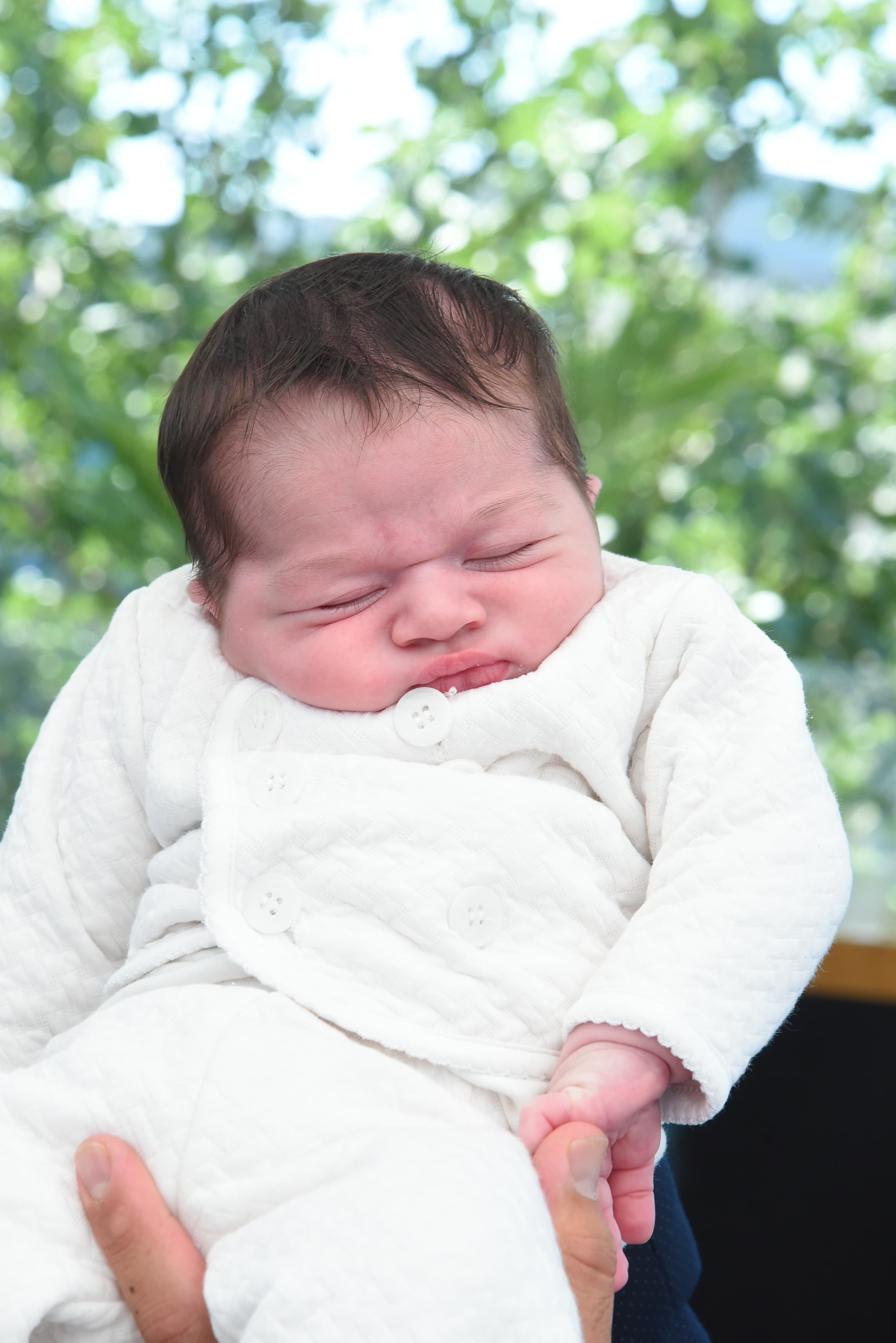 Newborn baby during Brit Milah photography session